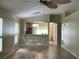 Open floor plan seamlessly connects living and dining areas with updated floors at 15421 Shoal Haven Pl, Ruskin, FL 33573