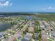 Scenic aerial shot capturing a sprawling residential community near a body of water under a clear, sunny sky at 1701 Bonita Bluff Ct, Ruskin, FL 33570