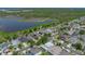 Desirable home, complete with solar panels, situated near a serene lake amidst a well-established residential area at 1701 Bonita Bluff Ct, Ruskin, FL 33570