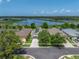 Home adorned with solar panels, nestled among lush trees in a beautiful neighborhood near a serene lake and nature preserve at 1701 Bonita Bluff Ct, Ruskin, FL 33570