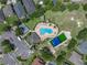 An aerial view of community amenities including a pool, playground, parking area and tennis court at 1701 Bonita Bluff Ct, Ruskin, FL 33570