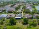An aerial view of a residential neighborhood featuring well-maintained homes and mature trees at 1701 Bonita Bluff Ct, Ruskin, FL 33570