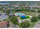 Aerial view showcases a community pool, playground, and lush landscaping; great for outdoor recreation at 1701 Bonita Bluff Ct, Ruskin, FL 33570