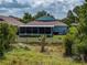 The home features a large screened lanai and well-maintained backyard at 1701 Bonita Bluff Ct, Ruskin, FL 33570