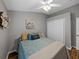 Comfortable bedroom with wood floors, a ceiling fan, and a relaxing atmosphere at 1701 Bonita Bluff Ct, Ruskin, FL 33570