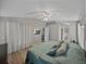 Inviting main bedroom featuring wood floors and neutral colors at 1701 Bonita Bluff Ct, Ruskin, FL 33570