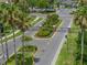 Gated community entrance with lush landscaping and palm trees offering security and curb appeal at 1701 Bonita Bluff Ct, Ruskin, FL 33570