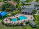 Community pool featuring lounge chairs and tables and a covered patio area for relaxing by the pool at 1701 Bonita Bluff Ct, Ruskin, FL 33570