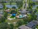Aerial view featuring a community pool, playground, and recreational amenities for residents' enjoyment at 1701 Bonita Bluff Ct, Ruskin, FL 33570
