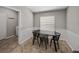Cozy dining area with a modern table setting and adjacent laundry room at 1701 Bonita Bluff Ct, Ruskin, FL 33570