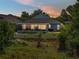 Charming home with screened lanai, grill, and lush backyard at 1701 Bonita Bluff Ct, Ruskin, FL 33570