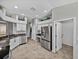 Modern kitchen featuring stainless steel appliances, granite countertops, and ample cabinet space at 1701 Bonita Bluff Ct, Ruskin, FL 33570