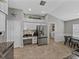 Well-lit kitchen featuring stainless steel appliances, granite countertops, and a view to the breakfast nook at 1701 Bonita Bluff Ct, Ruskin, FL 33570