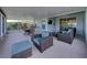 Spacious screened lanai with seating and ceiling fan at 1701 Bonita Bluff Ct, Ruskin, FL 33570