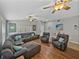 Bright and airy living room with a sectional sofa, comfortable armchairs, and stylish decor at 1701 Bonita Bluff Ct, Ruskin, FL 33570