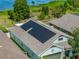 Aerial view of a home with solar panels, showcasing eco-friendly energy solutions and modern design at 1701 Bonita Bluff Ct, Ruskin, FL 33570