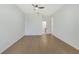 Spacious bedroom featuring modern wood floors and a ceiling fan at 1729 Arabian Ln, Palm Harbor, FL 34685
