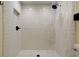 Walk-in shower with white subway tile, rain shower head, and niche for toiletries at 17631 Grove View Dr, Lutz, FL 33549