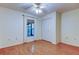 Neat bedroom with a ceiling fan, window, and closet providing functionality and comfort at 17631 Grove View Dr, Lutz, FL 33549