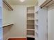 Organized walk-in closet with shelving, hanging rods, and ample storage space at 17631 Grove View Dr, Lutz, FL 33549