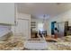 A view of the kitchen counter looking towards the stainless steel refrigerator and breakfast nook at 17631 Grove View Dr, Lutz, FL 33549