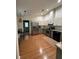 Bright kitchen featuring stainless steel appliances, granite countertops, and light wood floors at 17631 Grove View Dr, Lutz, FL 33549