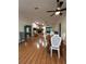 Open-concept living room with wood floors and inviting stone fireplace at 17631 Grove View Dr, Lutz, FL 33549
