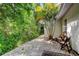 Outdoor patio area with brick pavers, side yard, and lush landscaping at 17631 Grove View Dr, Lutz, FL 33549