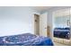 Cozy bedroom featuring closet and blue accent wall at 1851 Bough Ave # A, Clearwater, FL 33760
