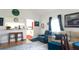 Cozy living room with front door, pass through to kitchen and comfortable seating at 1851 Bough Ave # A, Clearwater, FL 33760