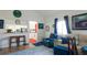 Comfortable living room with a view into the kitchen and front door at 1851 Bough Ave # A, Clearwater, FL 33760