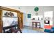 Cozy living room with wood floors and view into the kitchen at 1851 Bough Ave # A, Clearwater, FL 33760