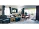 Cozy living room featuring comfortable seating, area rug, decor, and natural light at 1851 Bough Ave # A, Clearwater, FL 33760