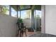 View of screened patio featuring outdoor seating and tile floor at 1851 Bough Ave # A, Clearwater, FL 33760