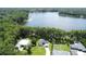 Beautiful aerial view of the waterfront property showcasing lake access and well-manicured lawns at 19209 Crooked Ln, Lutz, FL 33548