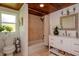 Clean bathroom featuring wood ceilings, neutral tiling, with a shower and vanity area at 19209 Crooked Ln, Lutz, FL 33548