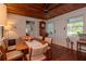 Inviting dining room with hardwood floors, wood-paneled ceilings, and ample natural light at 19209 Crooked Ln, Lutz, FL 33548