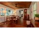 Spacious dining room with hardwood floors, ample natural light, and rustic charm at 19209 Crooked Ln, Lutz, FL 33548