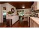 Open concept kitchen with white cabinets seamlessly integrates with the living area at 19209 Crooked Ln, Lutz, FL 33548