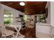 Charming kitchen with white cabinets, stainless steel appliances, and a bright, airy breakfast nook at 19209 Crooked Ln, Lutz, FL 33548