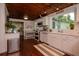 Updated kitchen featuring white cabinets, modern appliances, and seamless flow to the connected living spaces at 19209 Crooked Ln, Lutz, FL 33548