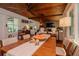 Open-concept living room and dining area with hardwood floors and a brick fireplace at 19209 Crooked Ln, Lutz, FL 33548