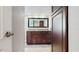 Bathroom boasts granite counters, wood cabinets, and ample storage space at 206 Hillcrest Dr, Safety Harbor, FL 34695