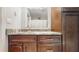 This bathroom features granite counters, wood cabinets, and ample storage at 206 Hillcrest Dr, Safety Harbor, FL 34695