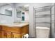 This bathroom features a sink, toilet, and chrome storage rack at 206 Hillcrest Dr, Safety Harbor, FL 34695
