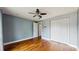 Bedroom featuring hardwood floors, fresh paint, ample closet space and ceiling fan at 206 Hillcrest Dr, Safety Harbor, FL 34695