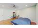 Neutral bedroom with wood floors, ceiling fan, and furniture at 206 Hillcrest Dr, Safety Harbor, FL 34695