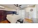 Bedroom with wood floors, ceiling fan, closet, and en-suite bathroom access at 206 Hillcrest Dr, Safety Harbor, FL 34695