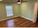 Cozy bedroom with hardwood floors, natural light and a relaxing atmosphere at 206 Hillcrest Dr, Safety Harbor, FL 34695