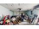 Cluttered garage interior with a variety of tools, equipment, and storage items at 206 Hillcrest Dr, Safety Harbor, FL 34695